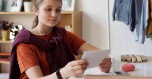 Girl Looking At A Picture