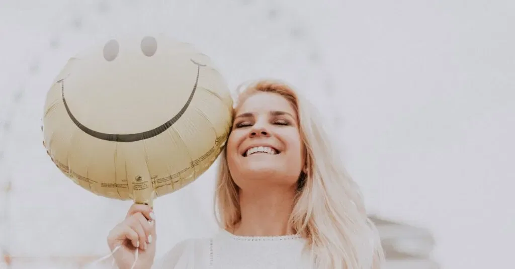 Cheerful Woman Holding A Smiley Balloon Outdoors On A Sunny Day, Exuding Happiness And Positivity.