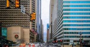 Vibrant Cityscape Of Philadelphia Showcasing Iconic Skyscrapers And Bustling Streets.