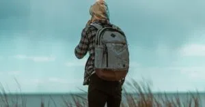 A Man With A Backpack Enjoys A Serene Oceanside View In Atlantic City, New Jersey.