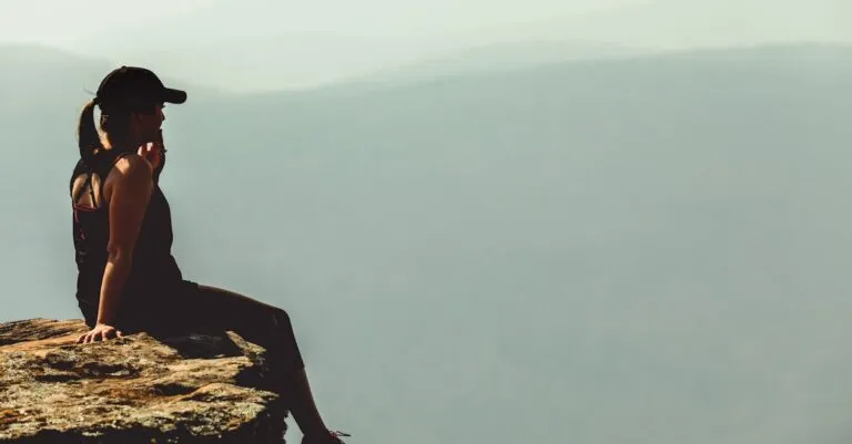 New York Blogs | Articles | News | Tips &Amp; Tricks | Video | Faq | Information | Infograph. 33 June 11, 2026 A Woman Enjoys A Calm Moment Sitting On A Cliff'S Edge Against A Foggy Mountainous Backdrop.