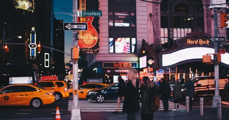 New York Blogs | Articles | News | Tips &Amp; Tricks | Video | Faq | Information | Infograph. 50 June 11, 2026 A Bustling Street View Of Broadway At Night Featuring Hard Rock Cafe, Taxis, And Pedestrians In New York City.