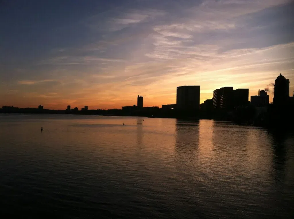Captivating View Of Boston'S Skyline In Silhouette Against A Colorful Twilight Sky.