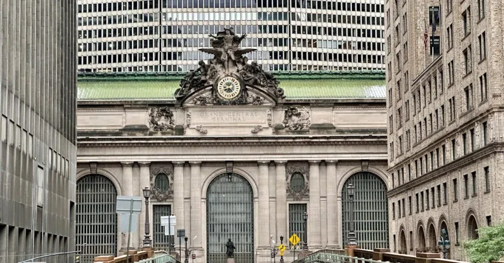 Exterior View Of Grand Central Terminal In New York City With Urban Architecture.