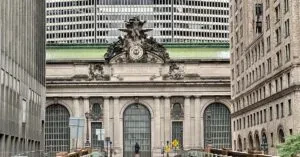 Exterior View Of Grand Central Terminal In New York City With Urban Architecture.