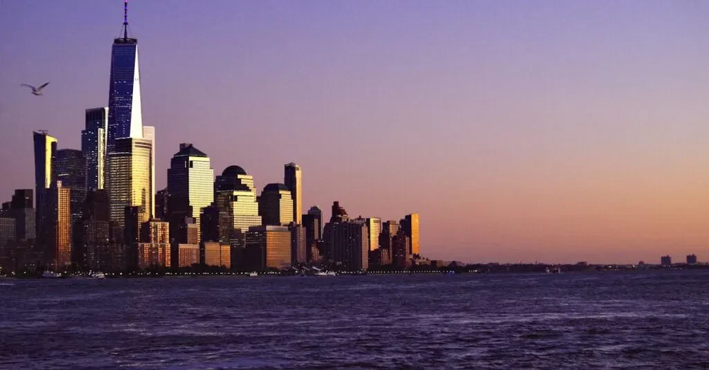 Breathtaking View Of New York City Skyline At Sunset With Waterfront And Iconic Skyscrapers.