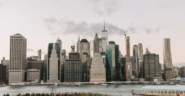 Captivating View Of New York City'S Iconic Skyline With High-Rise Buildings And Waterfront.