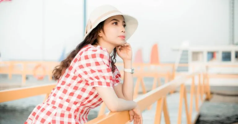 New York Blogs | Articles | News | Tips &Amp; Tricks | Video | Faq | Information | Infograph. 47 June 11, 2026 A Woman In A Red Checkered Dress And Hat Enjoys A Sunny Day On A Pier, Embodying Summer Relaxation.
