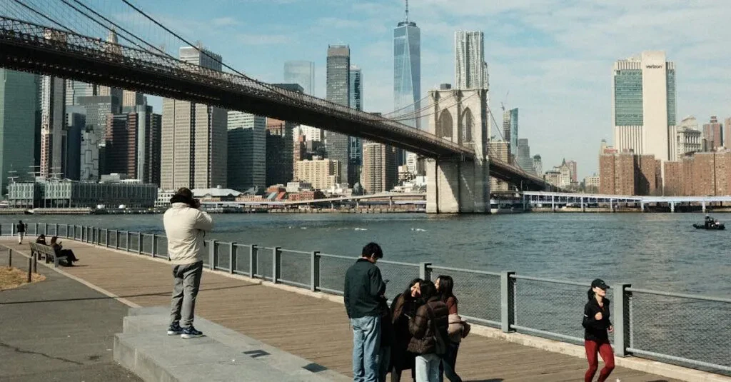Cab Jfk To Manhattan: The Ultimate Guide To A Smooth Ride 2 April 15, 2026 Scenic View Of Brooklyn Bridge And New York City Skyline With People On Promenade.