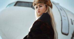 Luxury Car &Amp; Limo Services Articles &Amp; News 3 June 19, 2026 Stylish Woman In Fur And Hat Posing Near Aircraft In Winter Setting.