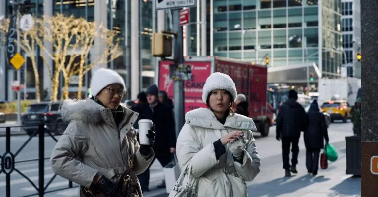 New York Blogs | Articles | News | Tips &Amp; Tricks | Video | Faq | Information | Infograph. 38 June 11, 2026 Two Women In Winter Coats Walking On A Bustling City Street With Holiday Lights.