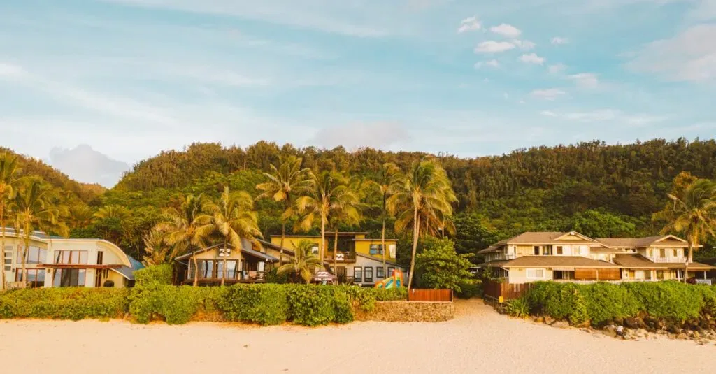 Beautiful Beachfront Villas With Palm Trees On A Sandy Coastline. Ideal Tropical Getaway.