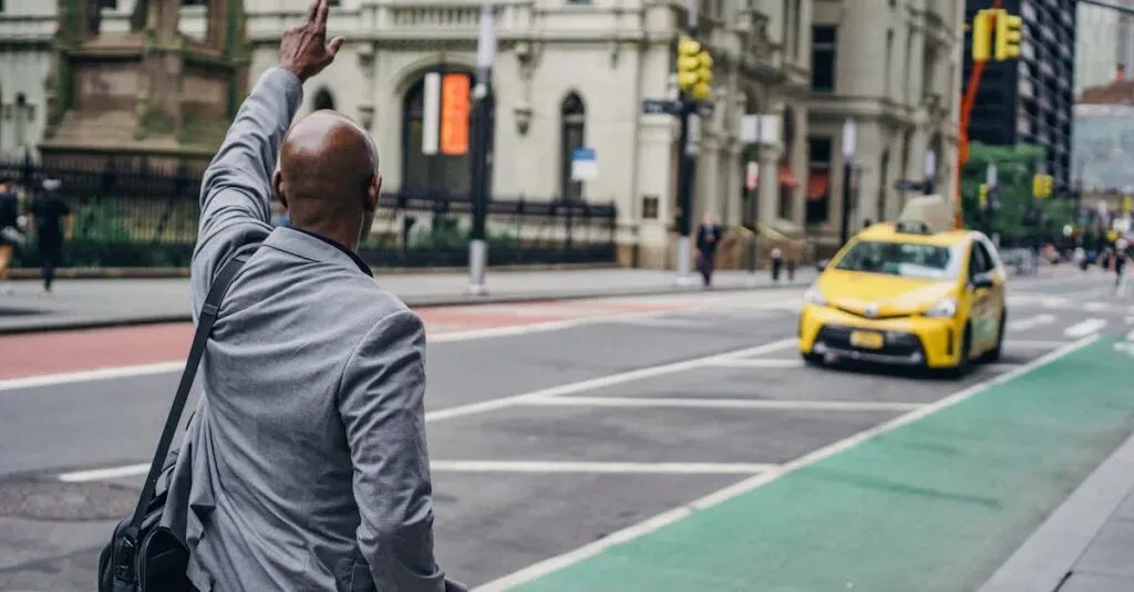 The Ultimate Guide To Finding A Reliable Cab In Atlantic City 1 April 16, 2026 Back View Of Anonymous African American Male With Hand Up Catching Yellow Cab On Blurred Background Of Road