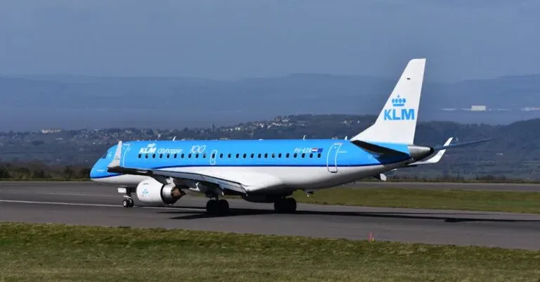 A Klm Cityhopper Embraer Plane Prepares For Takeoff On A Sunny Day.