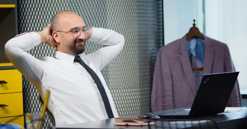 Bald Man Smiling And Relaxing At His Desk In A Modern Office.
