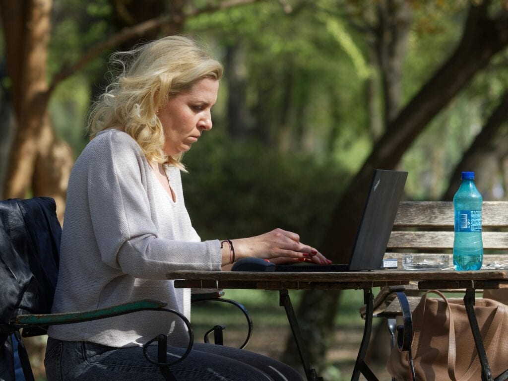 How To Get From Lga To Jfk: 5 Honest Options For Families In 2026 3 April 14, 2026 Nyc Limo Services Black Sedan At Jfk Airport Pickup Zone Queens New York