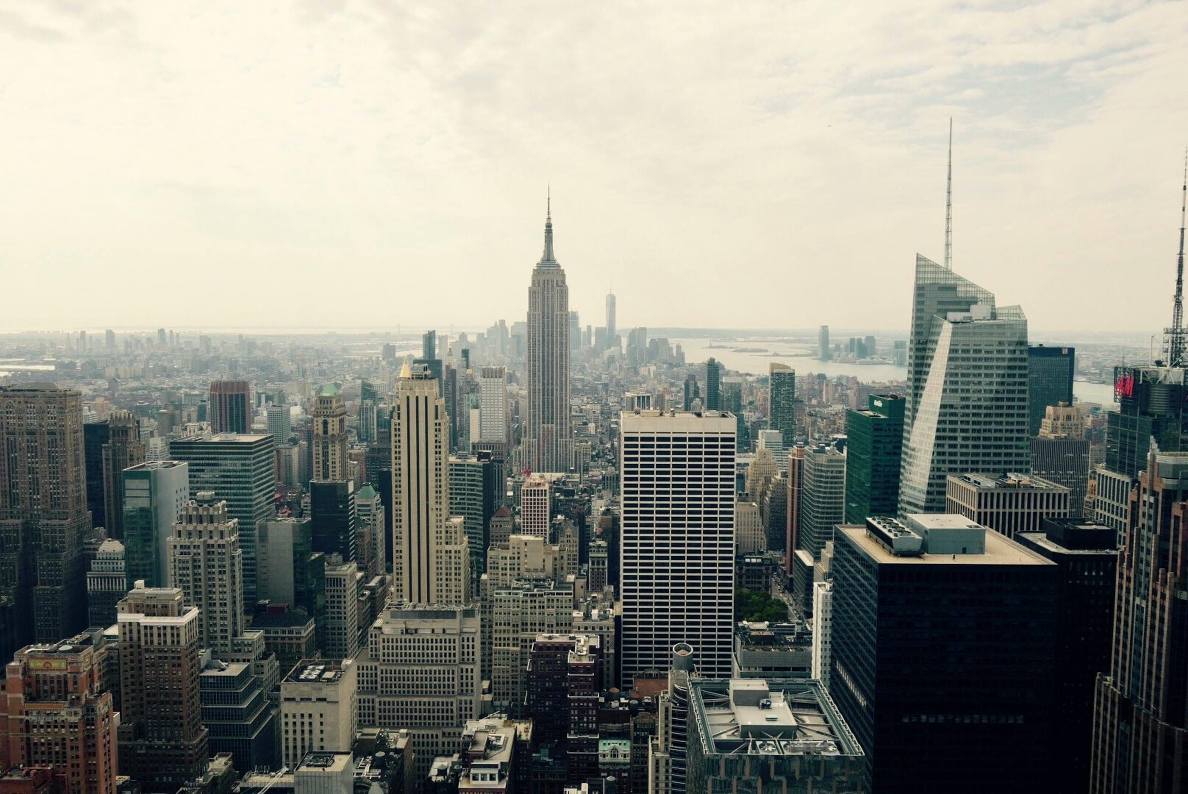 Breathtaking Aerial View Of New York City'S Iconic Skyline Featuring The Empire State Building.