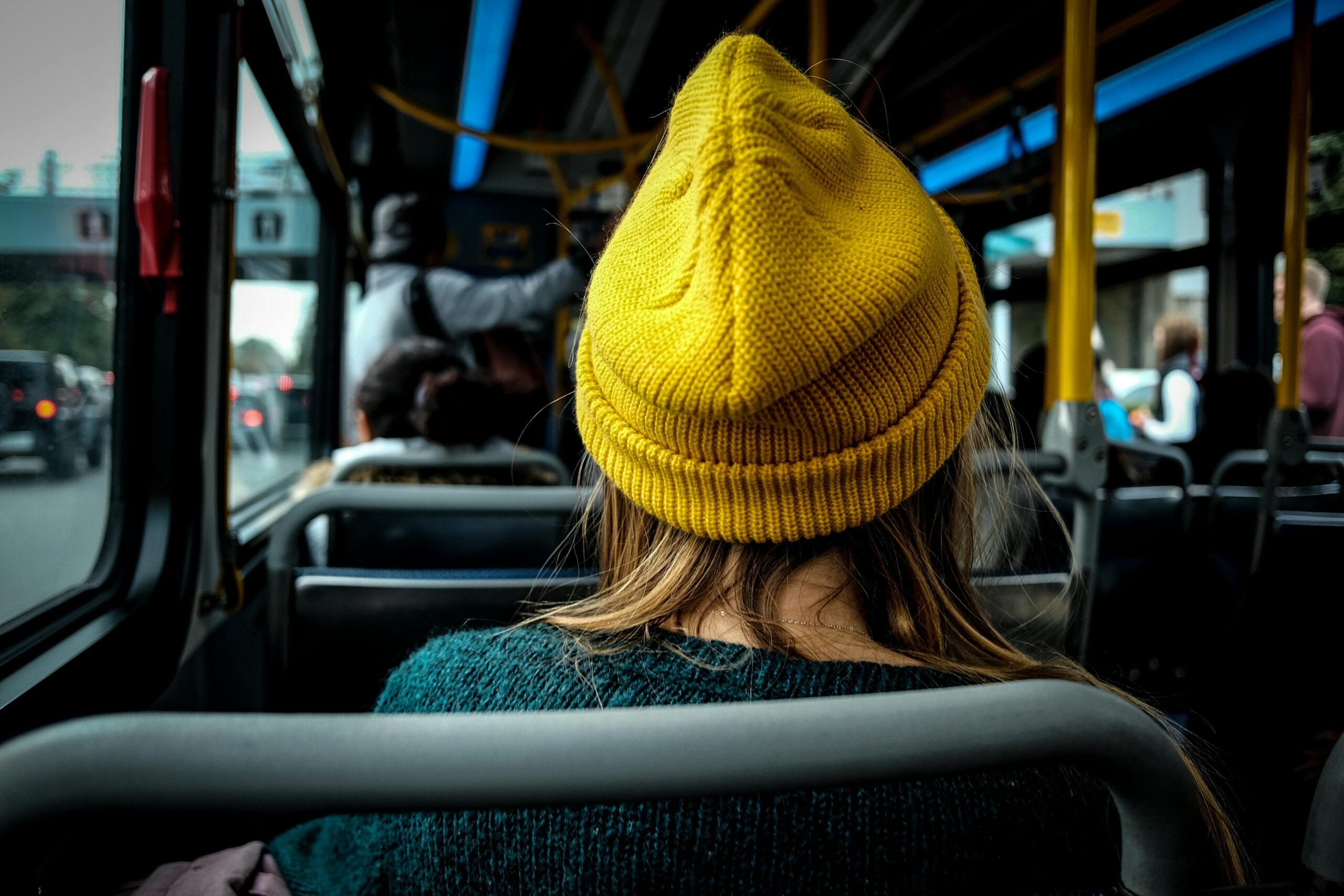 Blogs | Articles | News | Tips &Amp; Tricks | Video | Faq | Infomation 6 April 14, 2026 Woman In A Yellow Beanie Riding On A Public Bus, Viewed From Behind.