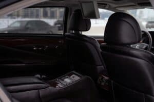 Wedding &Amp; Event Transportation Articles &Amp; News 2 June 16, 2026 Elegant Interior Of A Luxury Vehicle With Black Leather Seats And Wood Paneling. Perfect For Travel And Comfort Images.