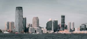 News &Amp; Tips Articles 4 May 30, 2026 A Breathtaking View Of Jersey City'S Skyline From Across The Hudson River With Modern Skyscrapers And Waterfront Buildings.
