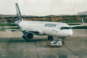 Aegean Airlines Aircraft Being Towed At An Airport, Ready For Takeoff.