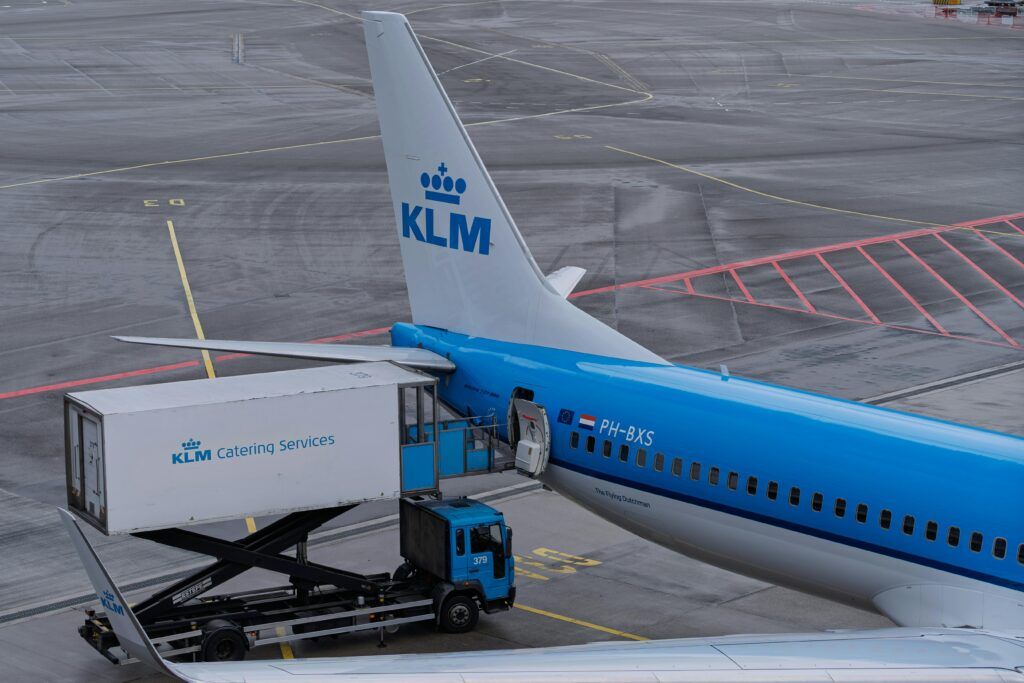 Klm Airplane Receiving Catering Services At An Airport, Showcasing Aviation Logistics.
