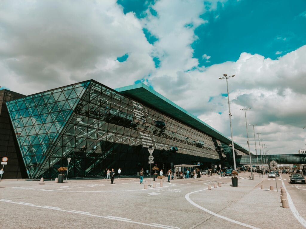 Number 1 Airport Luxury Transportation Close To Me: 7 Honest Facts For Nyc Visitors 2026 7 May 24, 2026 Contemporary Airport Terminal Featuring Striking Glass Facade Under A Cloudy Sky.
