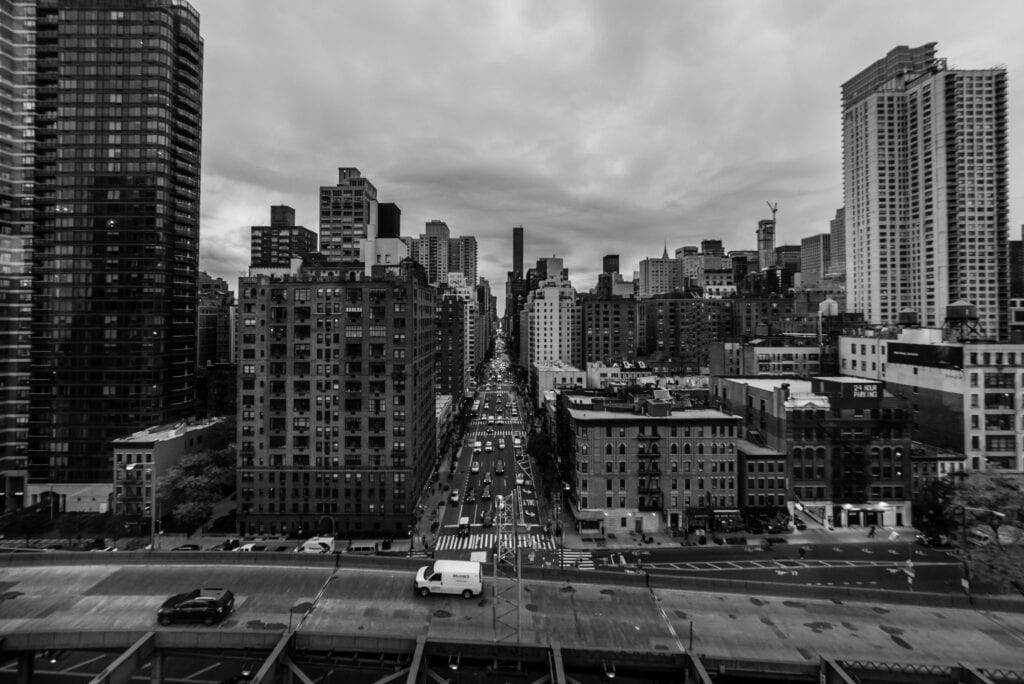 Luxury Car New York: 6 Honest Facts For Families In 2026 9 May 24, 2026 A Dramatic Black And White View Of New York City Skyline With A Bustling Street.