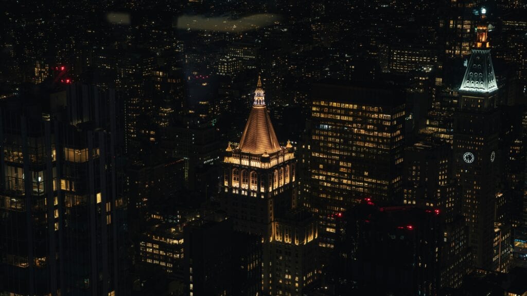 Captivating Aerial View Of New York City'S Illuminated Skyline At Night, Showcasing Iconic Architecture.