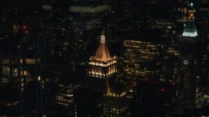 Captivating Aerial View Of New York City'S Illuminated Skyline At Night, Showcasing Iconic Architecture.