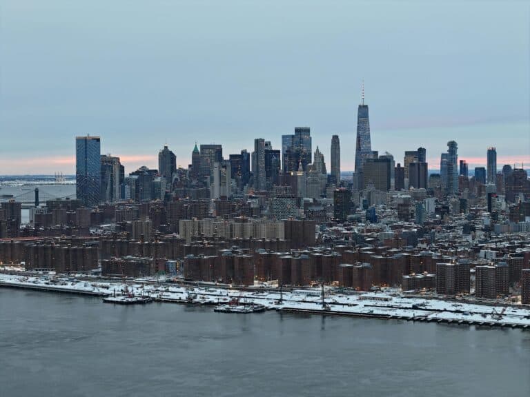 A Stunning Aerial Shot Of New York City Skyline Covered In Snow During The Day.