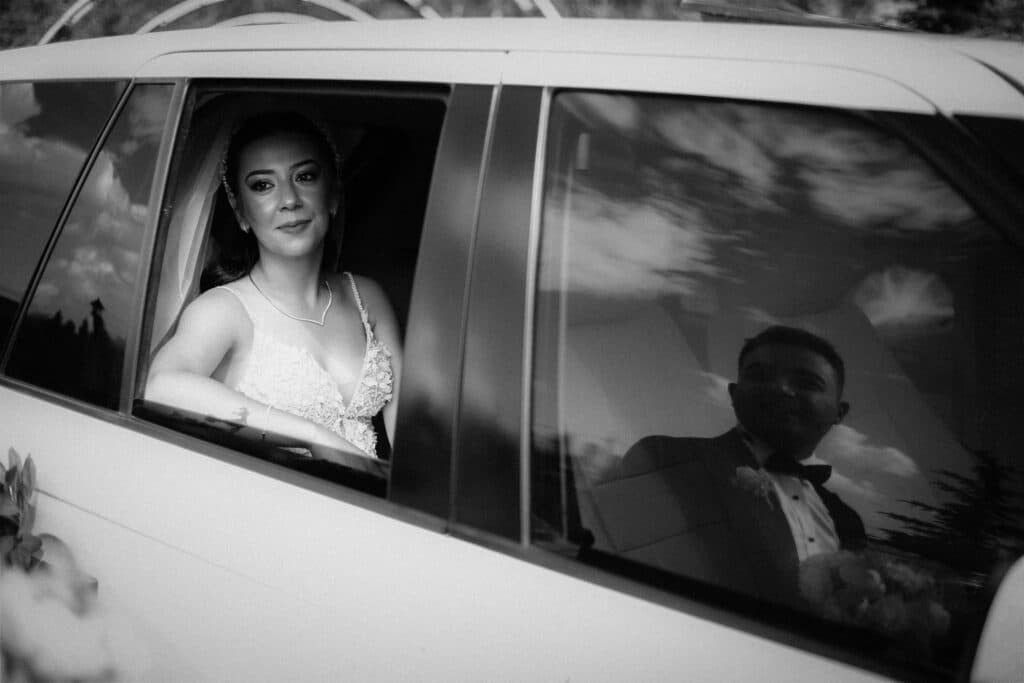 Rent Stretch Limousine Nyc: 7 Honest Facts For First-Timers 2026 9 June 17, 2026 Bride And Groom Captured In A Limousine With Reflective Windows During A Wedding.