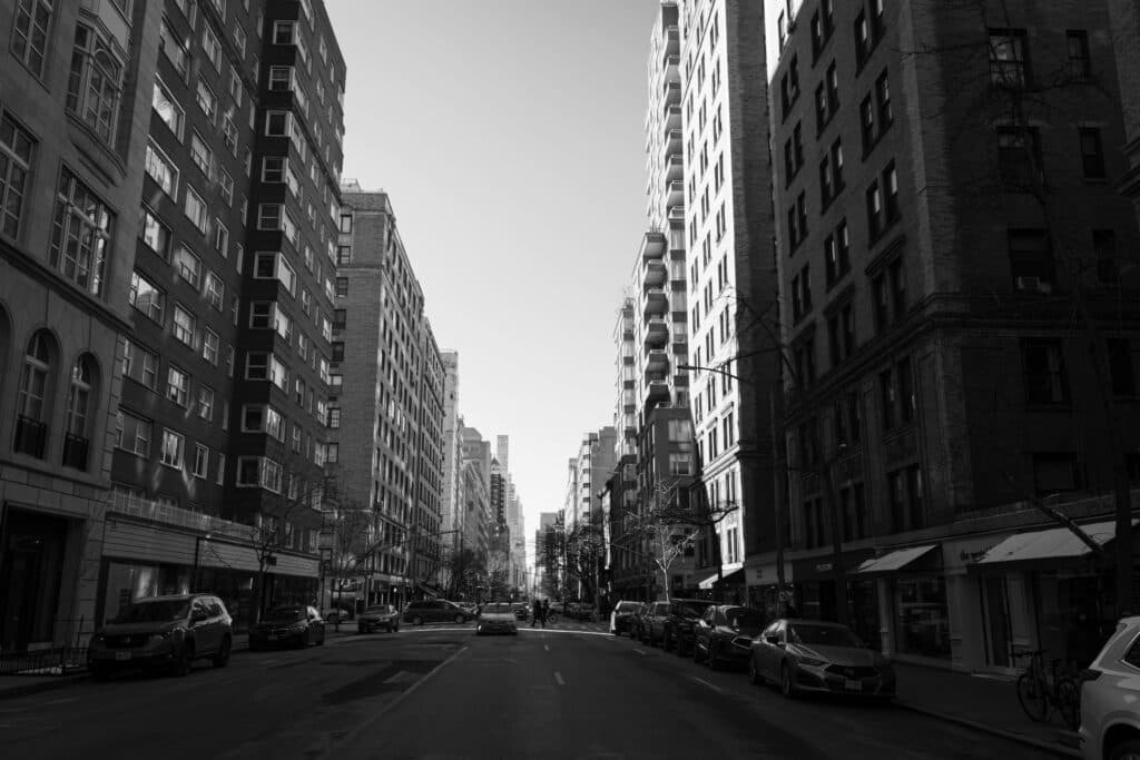 Service Car Nyc For Families: 5 Honest Seasonal Facts For 2026 9 June 10, 2026 Urban Cityscape In Black And White Capturing A Quiet New York City Street.