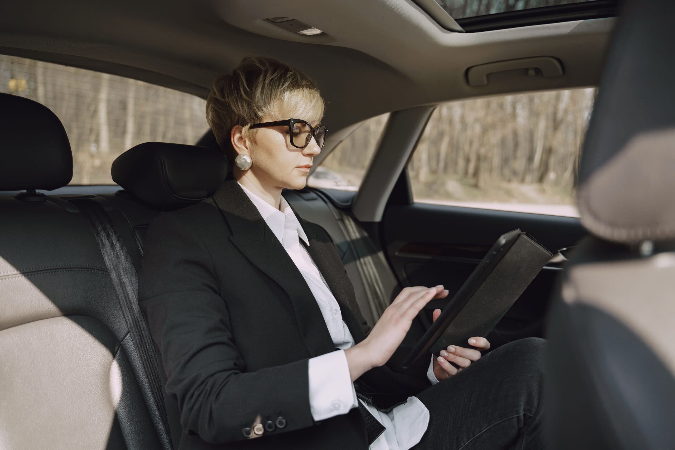 Blogs | Articles | News | Tips &Amp; Tricks | Video | Faq | Infomation 1 June 13, 2026 Side View Of Focused Female In Stylish Formal Clothes Using Tablet While Riding On Backseat Of Modern Car