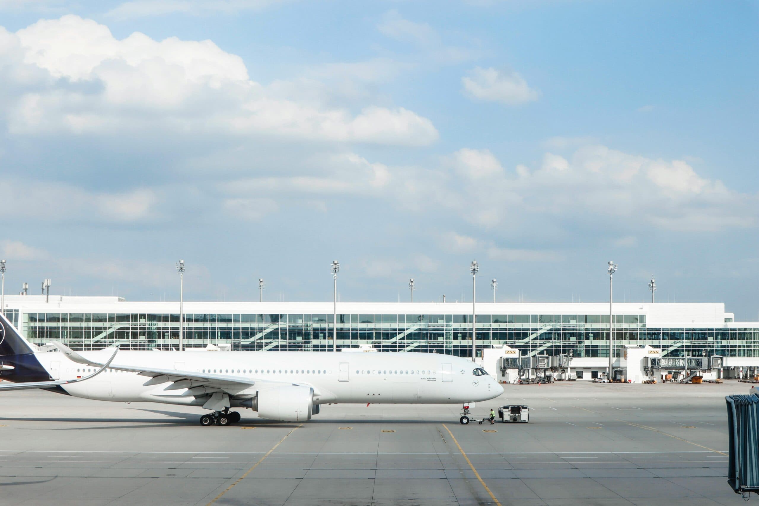 Blogs | Articles | News | Tips &Amp; Tricks | Video | Faq | Infomation 1 June 10, 2026 Widebody Aircraft Parked At An Airport Gate During Clear Day With Terminal Building Visible.