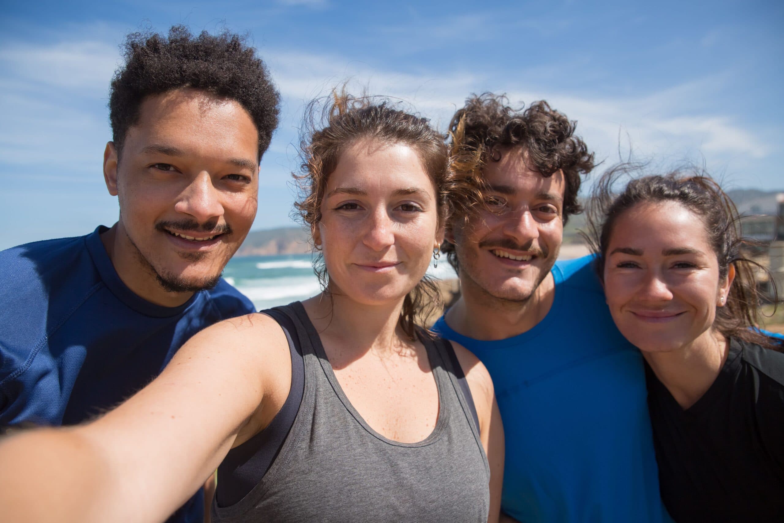 Blogs | Articles | News | Tips &Amp; Tricks | Video | Faq | Infomation 5 June 7, 2026 Four Young Adults Smiling At The Beach, Capturing A Joyful Moment Under The Sunny Sky.