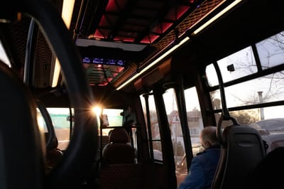 Captivating Interior Of A Bus In İstanbul With Warm Sunset Lighting Through The Windows.