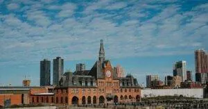 Scenic View Of The Historic Central Railroad Of New Jersey Terminal With Modern Skyline In Jersey City.