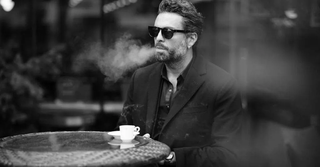 Bus From Philadelphia To New York: The Ultimate Guide To Affordable And Comfortable Travel 1 February 28, 2026 Black And White Photo Of A Well-Dressed Man Smoking At A Café, Enjoying Espresso.
