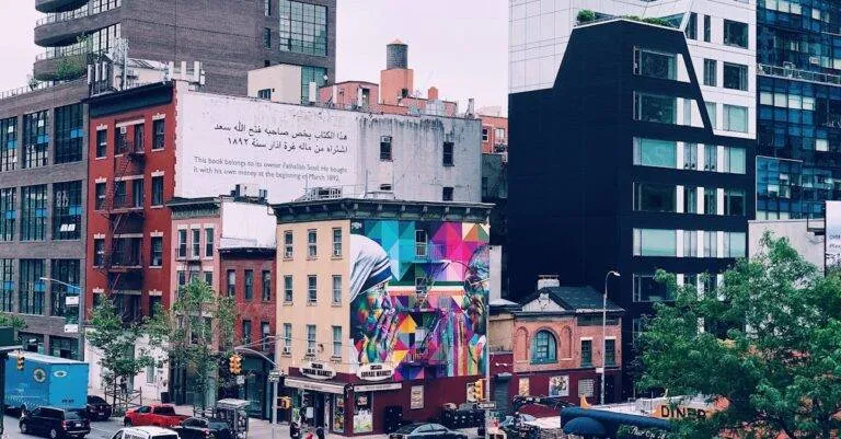 Colorful Cityscape Of New York With Urban Murals, Modern Architecture, And Bustling Street Life.