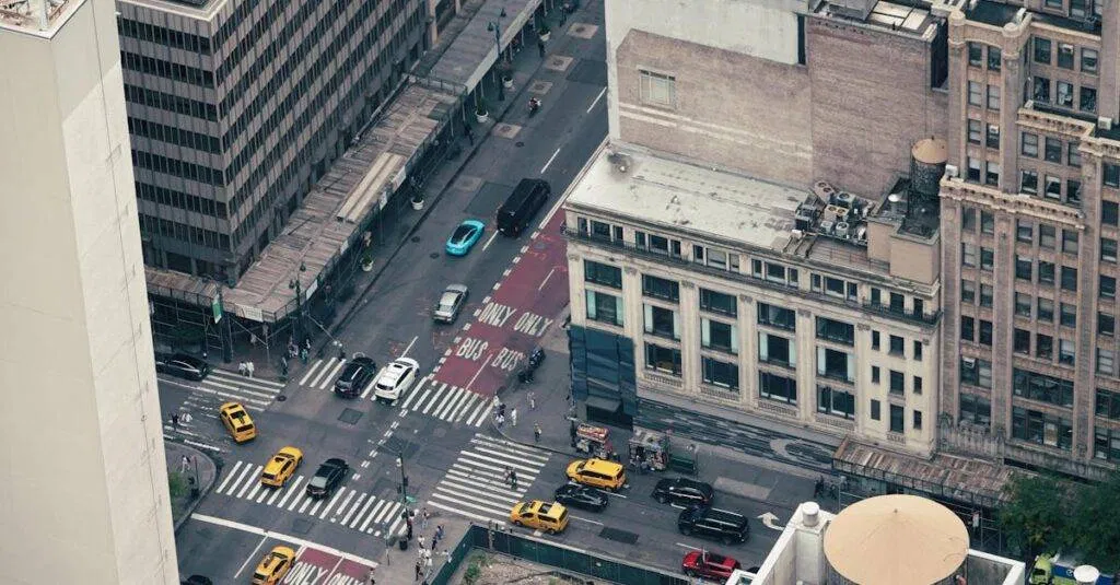 Busy New York City Intersection With Yellow Cabs And Skyscrapers, Captured From Above.