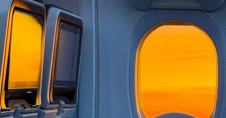 The Sun Shines Through The Window Of A Turkish Airlines Flight.