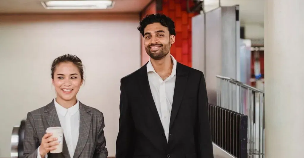 Two Smiling Professionals Walking In A New York Subway Station, Holding Coffee And Briefcase.