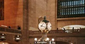 Interior Of Grand Central Terminal Featuring Its Iconic Clock Over The Information Booth.