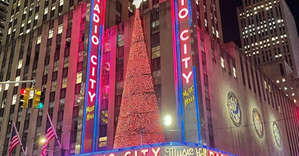Night Scene Of Radio City Music Hall In New York City, Beautifully Lit Up With Festive Lights.