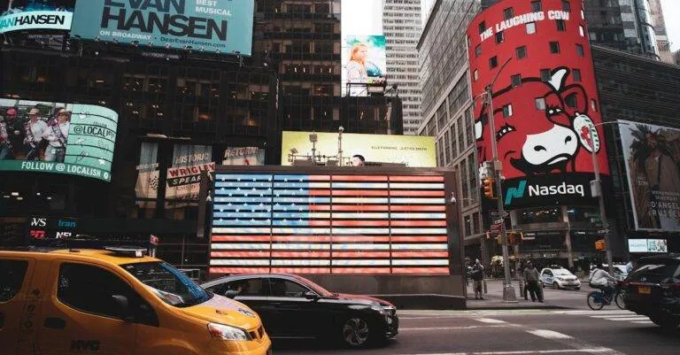 Dynamic View Of Times Square With Iconic Billboards And Yellow Taxi In New York City.