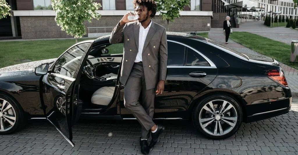 A Fashionable Businessman Stands By A Luxury Car, Enjoying A Drink On A City Street.