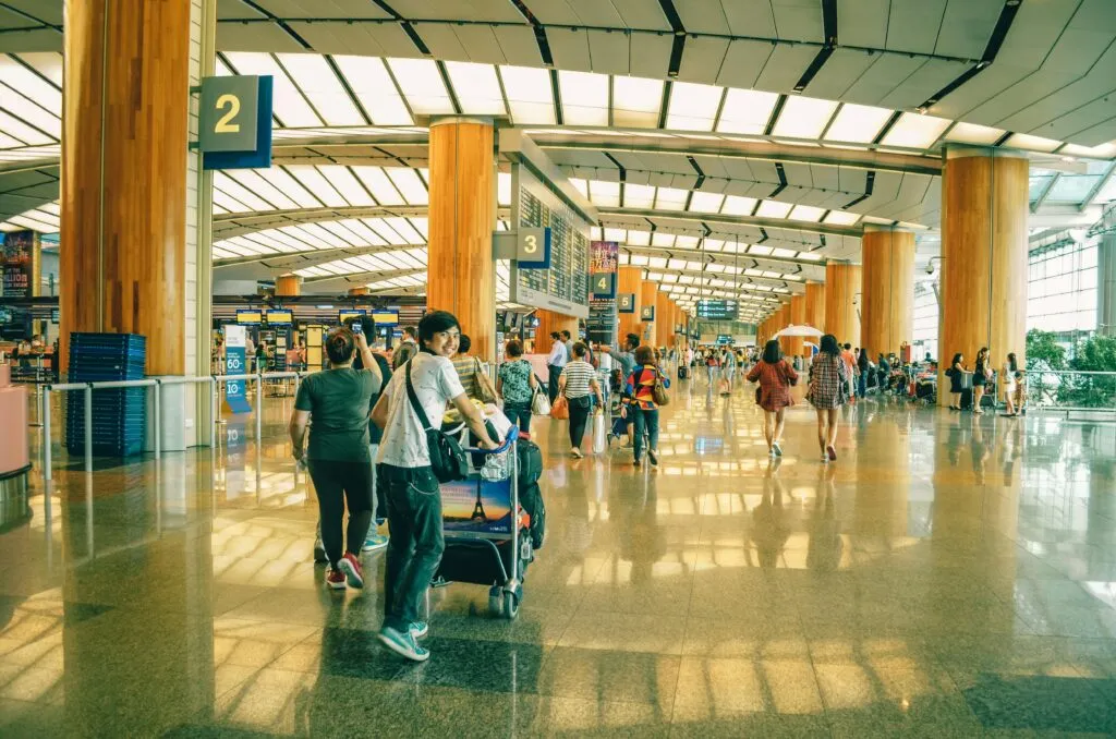 Luxury private car to airport waiting at JFK terminal for stress-free pickup