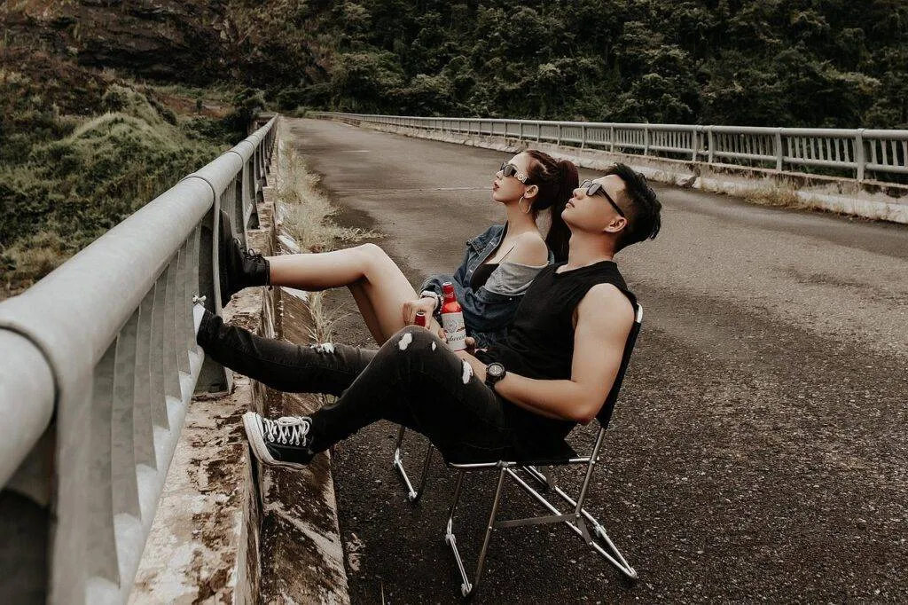 A Sleek Black Jetblack Sedan Crosses The Queensboro Bridge At Dusk, Manhattan’s Skyline Glowing Ahead, Showcasing A Premium Option For How To Get From Lga To Manhattan In 2025. Rain Streaks The Window, Capturing The Gritty Charm Of Nyc’s Evening Commute.
