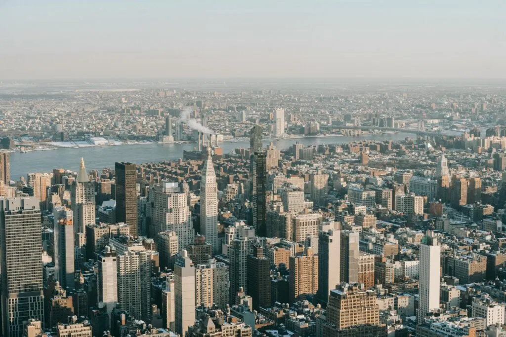 Spectacular Drone View Of New York City Skyline With Modern Skyscrapers And Towers Near Hudson River On Sunny Day
